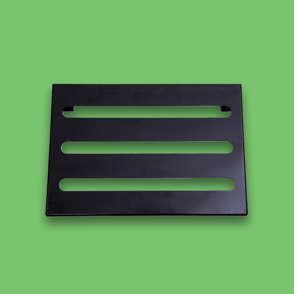 A top view of an incline black guitar effects pedalboard made of single sheet of aluminium with 2 legs and rubber bushings.