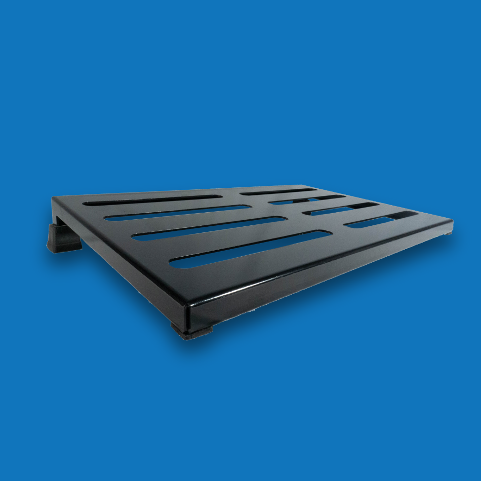 An angled view of a large incline black guitar effects pedalboard made of single sheet of aluminium with 2 legs and rubber bushings.
