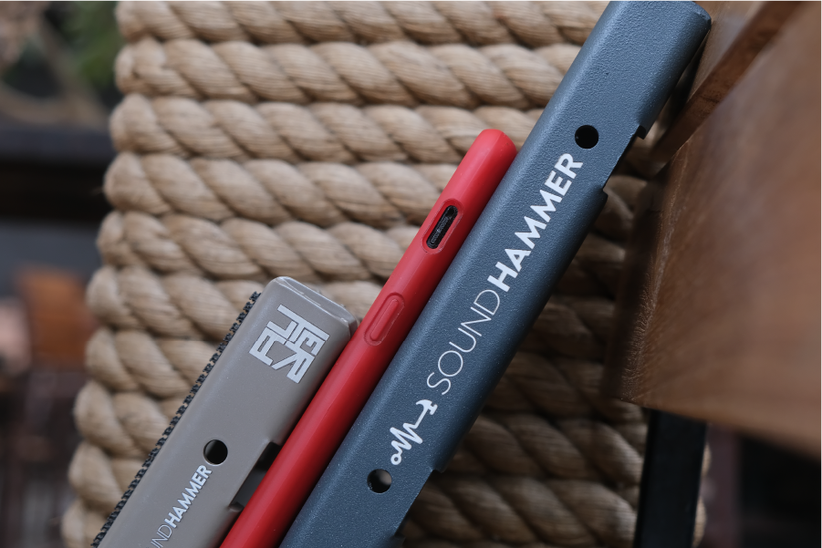 couple of modular pedalboards kept slated on a chair