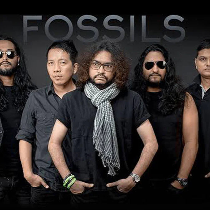 members of fossils band standing in black apparel