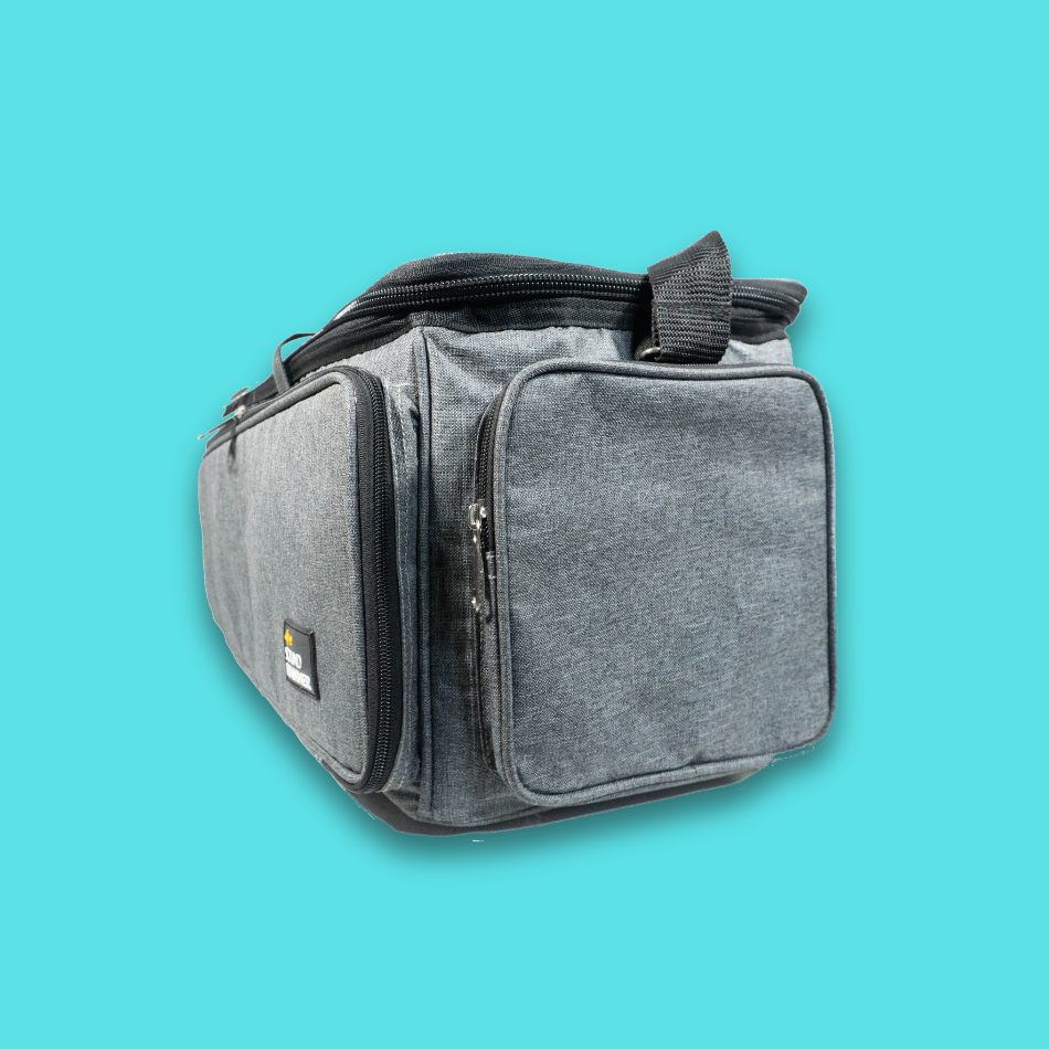 A angled side view of large cable bag in grey color with pouches and straps