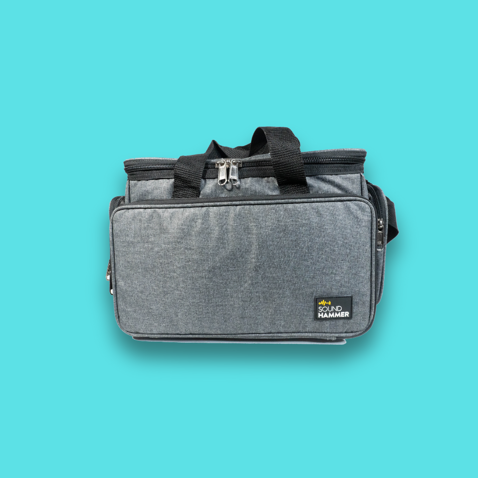 A front view of small cable bag in grey color with pouches and straps