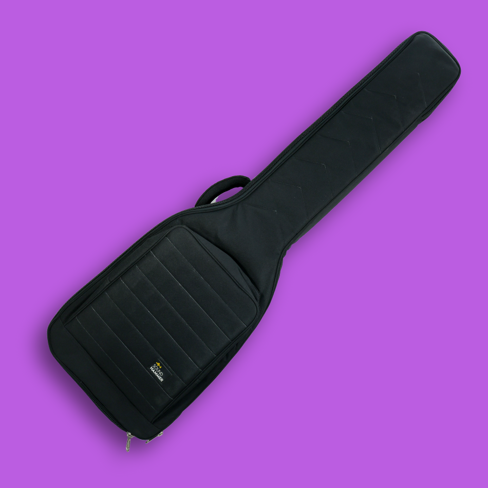 A tilted view of black guitar case for bass guitar with front pouch & carry handle.