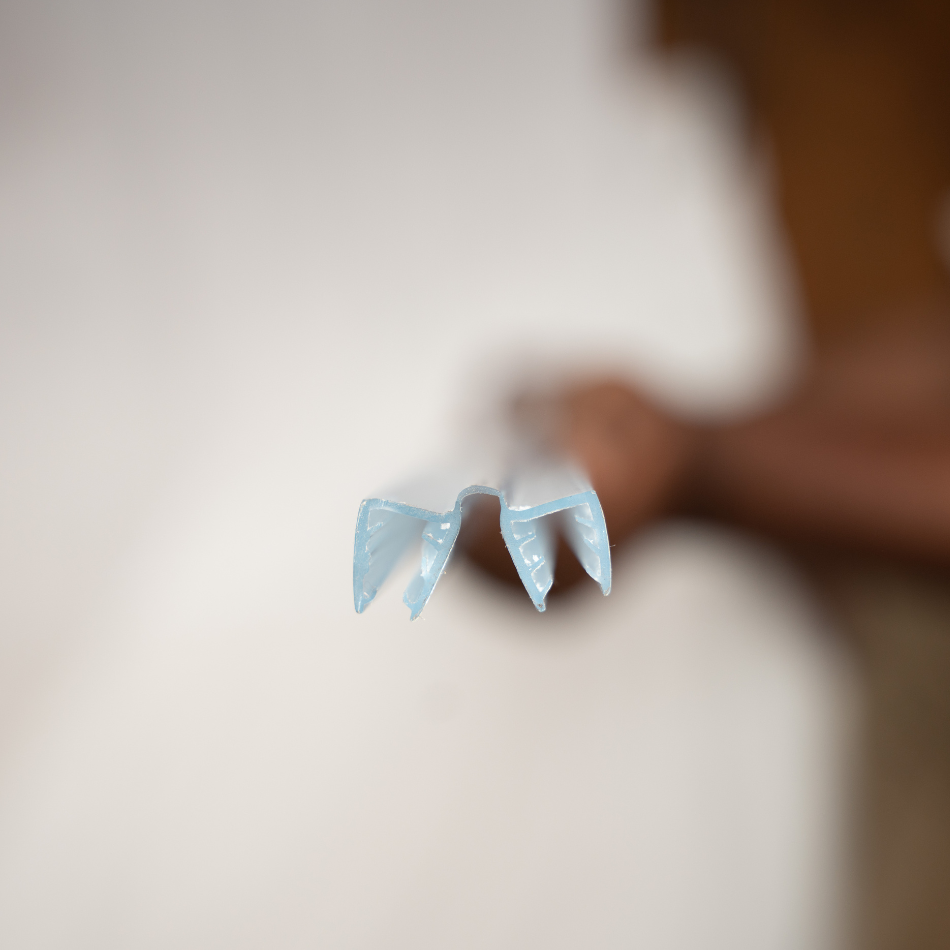 A close up top view of  acrylic sound seal hinge placed onto the acrylic sheet of drum shield for complete sound seal.