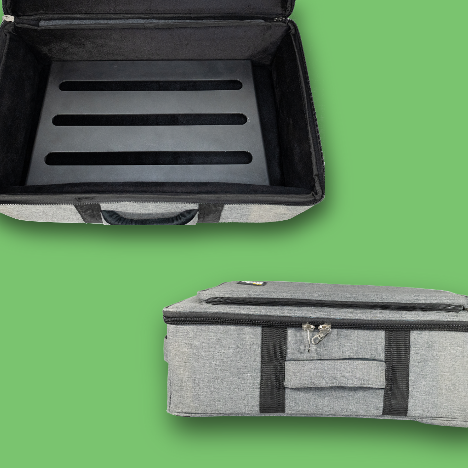 Gray pedalboard gig bag with black interior and exterior on a green background