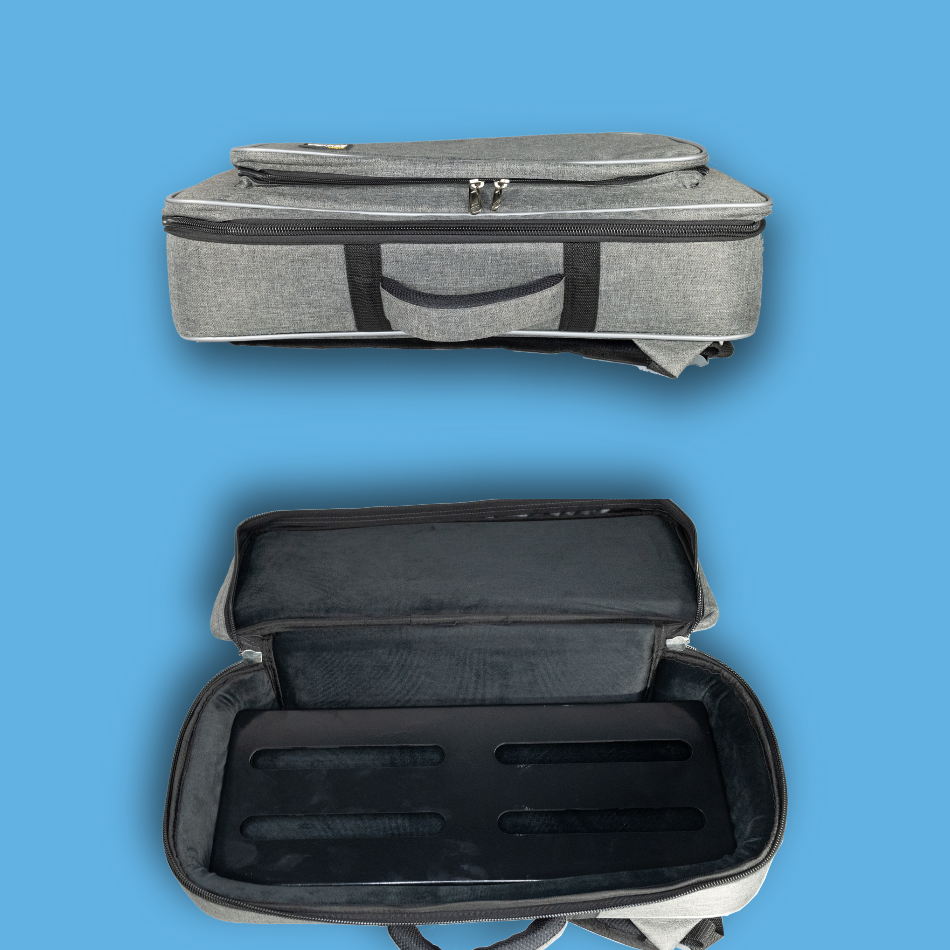 Gray pedalboard gig bag with open interior on a blue background