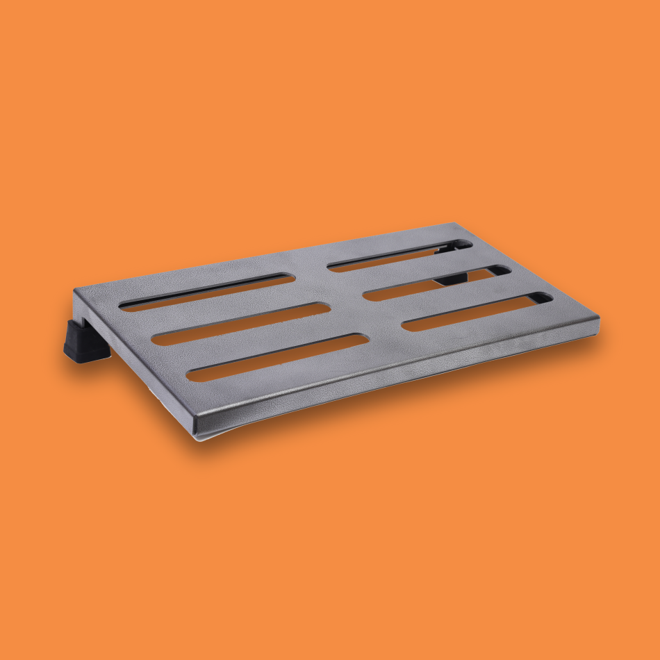 An angled view of a medium incline grey guitar effects pedalboard made of single sheet of aluminium with 2 legs and rubber bushings.