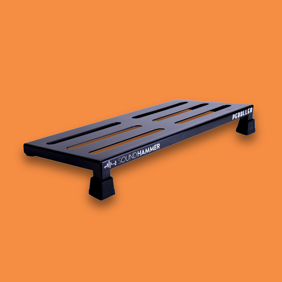 A top angled view of a medium incline black guitar effects pedalboard made of single sheet of aluminium with 2 legs and rubber bushings with Soundhammer logo.