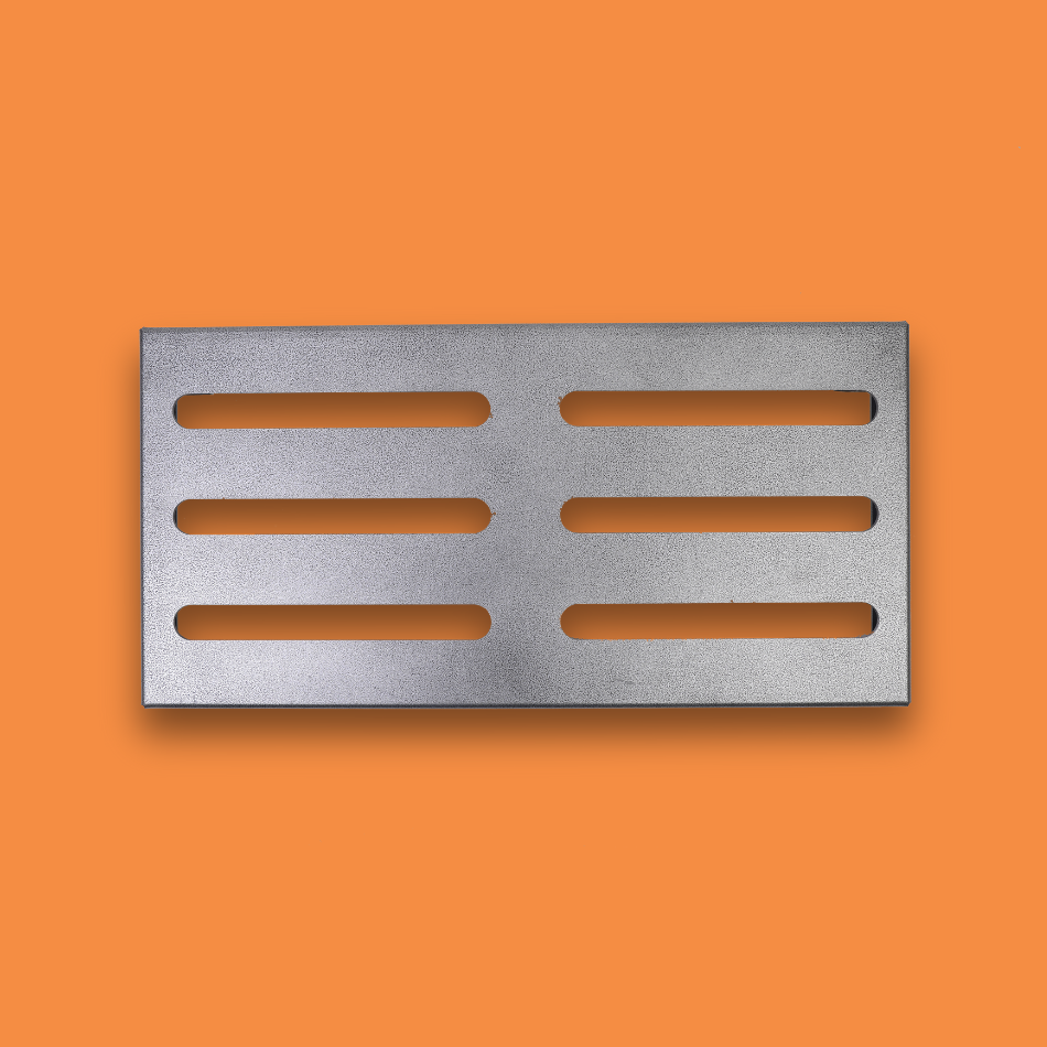 A top view of a medium incline grey guitar effects pedalboard made of single sheet of aluminium with 2 legs and rubber bushings.