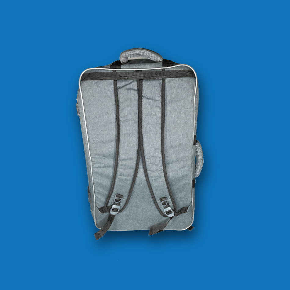Gray large pedalboard gig bag with back straps on a blue background