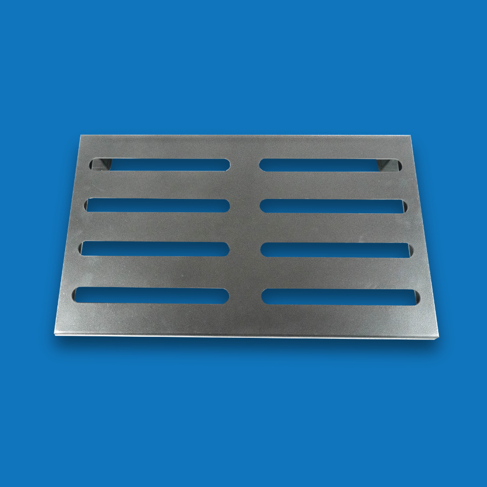 A top view of a large incline grey guitar effects pedalboard made of single sheet of aluminium with 2 legs and rubber bushings.